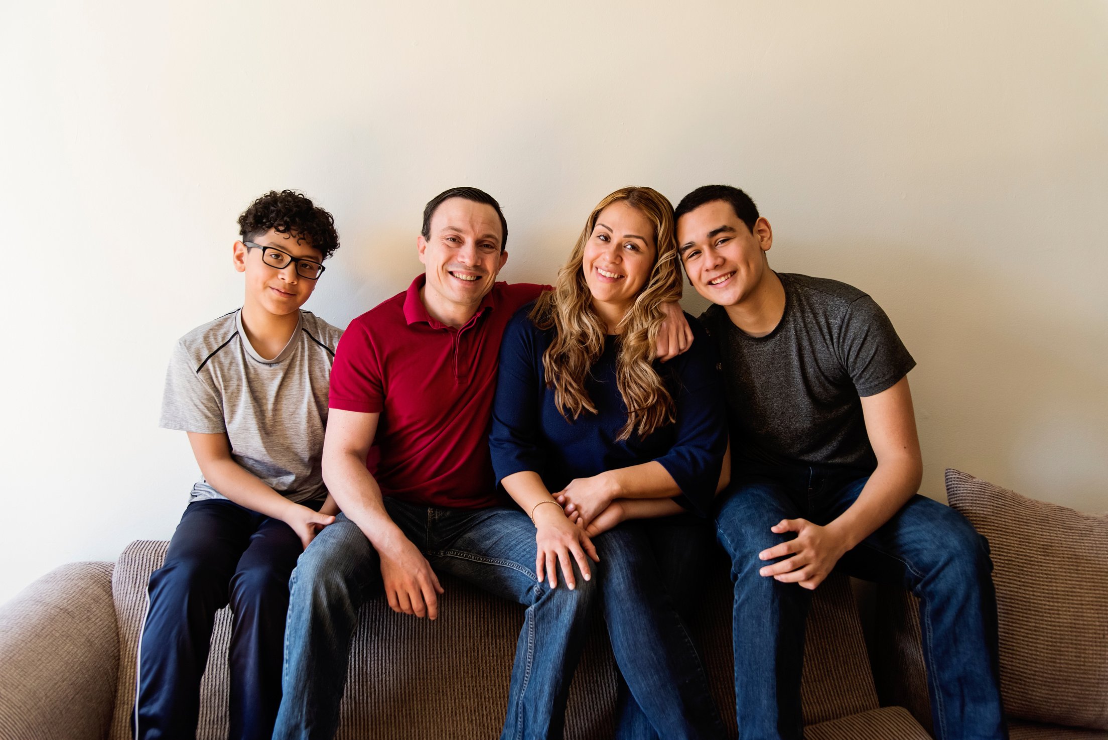 Multi-ethnic family with teenage boys portraits.